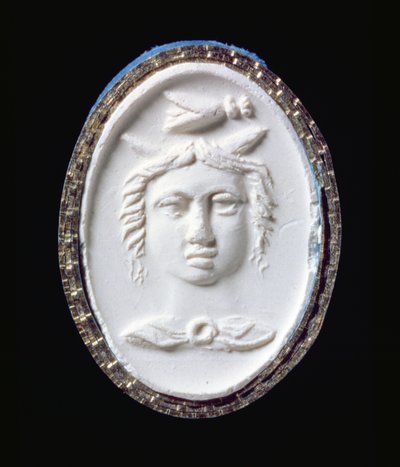 Impression of a gold ring with a facing head by Scythian